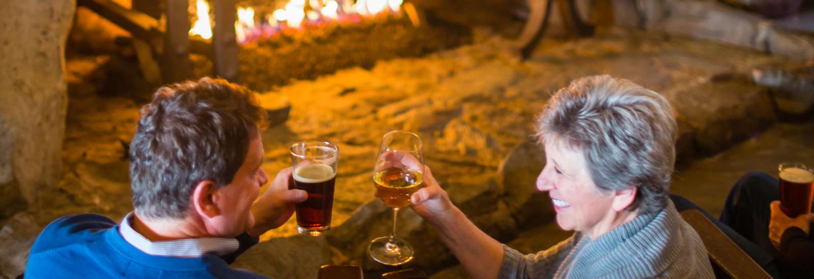 Couple by Cozy Fireplace at The Omni Grove Park Inn